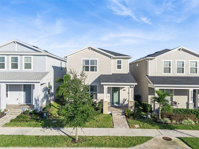 Front exterior of a new home in , Winter Garden, FL, highlighting curb appeal (Image 33).