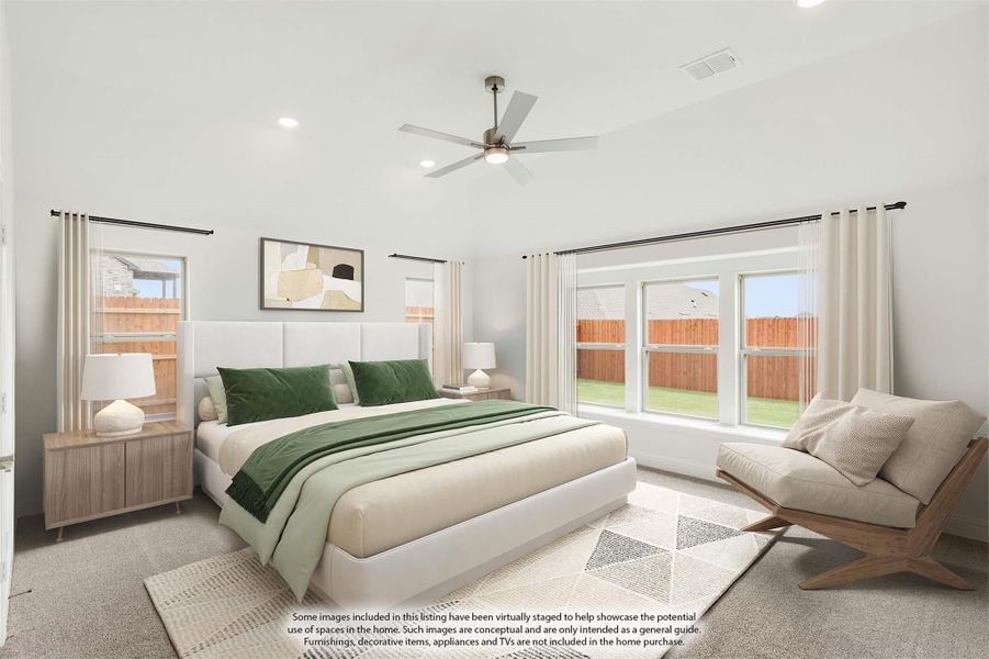 Spacious master bedroom with vaulted ceiling, ceiling fan, large windows, and neutral carpet flooring