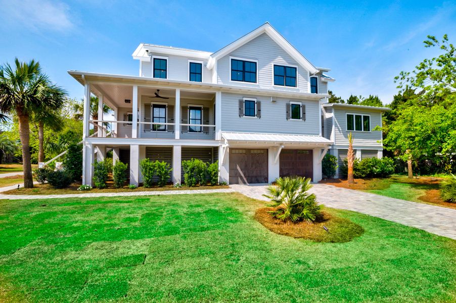 Front exterior of a new home in , Sullivan's Island, SC, highlighting curb appeal (Image 22).