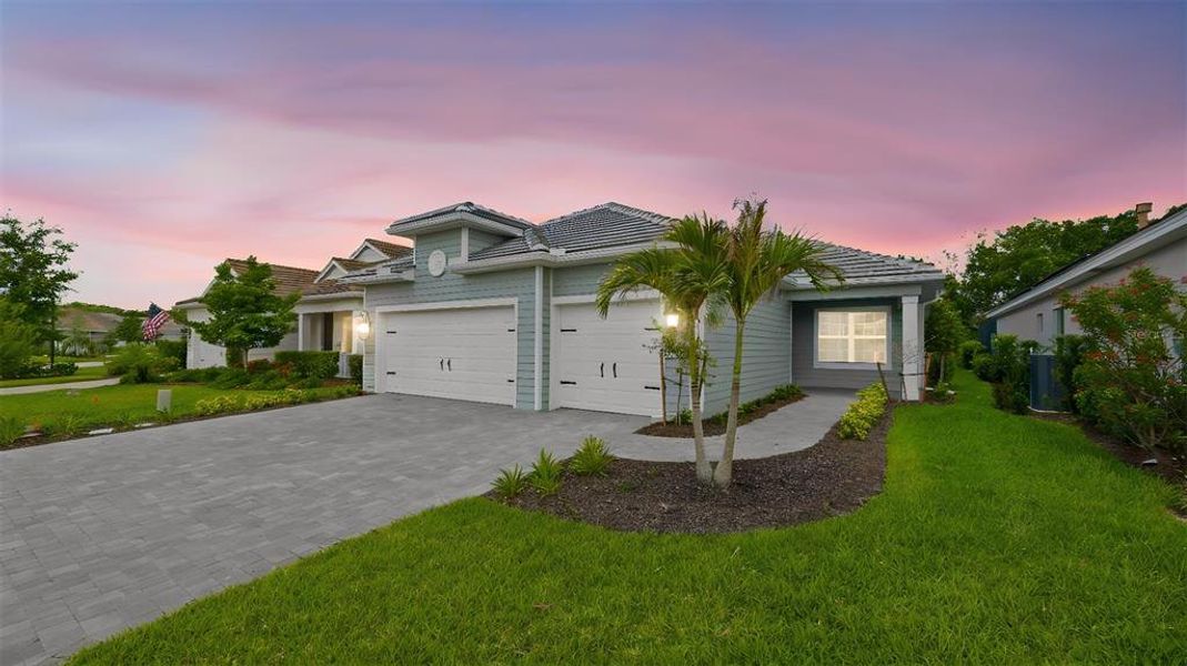 Front exterior of a new home in , Fort Myers, FL, highlighting curb appeal (Image 1). Front exterior of a new home in , Fort Myers, FL, highlighting curb appeal (Image 1).