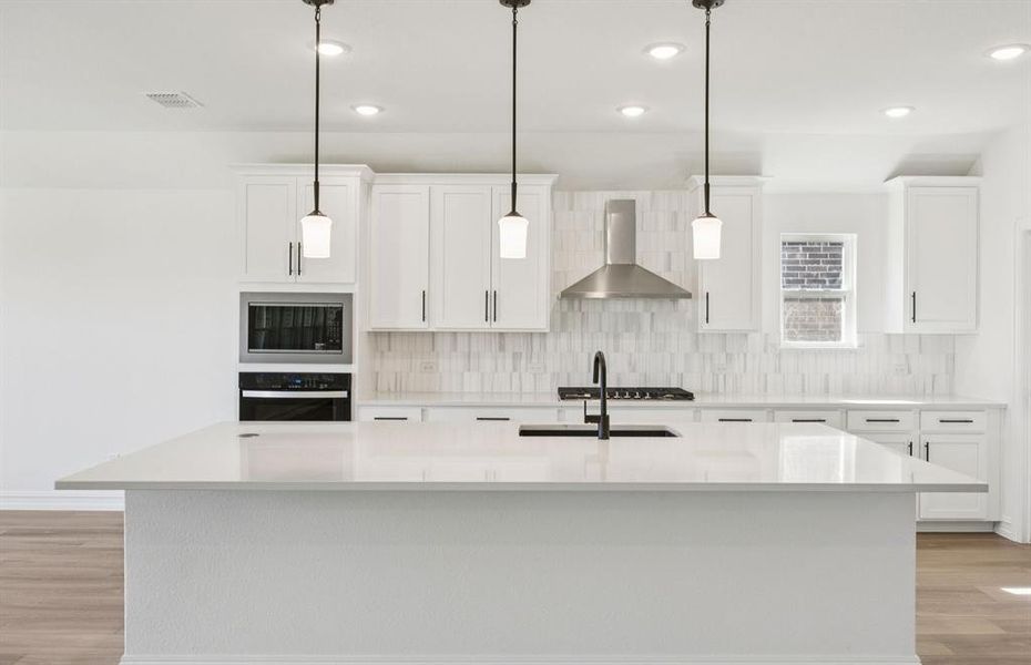 Spacious kitchen with eat-in bartop island Spacious kitchen with eat-in bartop island
