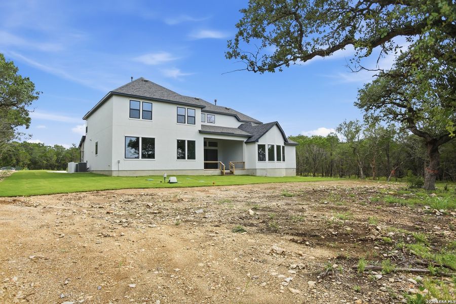 Exterior details and patio area of a home in Enchanted Bluff, San Antonio (Image 4).
