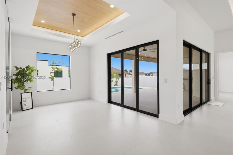 Light-filled dining area offers seamless indoor-outdoor flow with direct access to the pool and lanai. Light-filled dining area offers seamless indoor-outdoor flow with direct access to the pool and lanai.