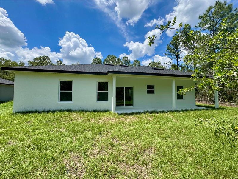 Exterior details and patio area of a home in , Citrus Springs (Image 20).