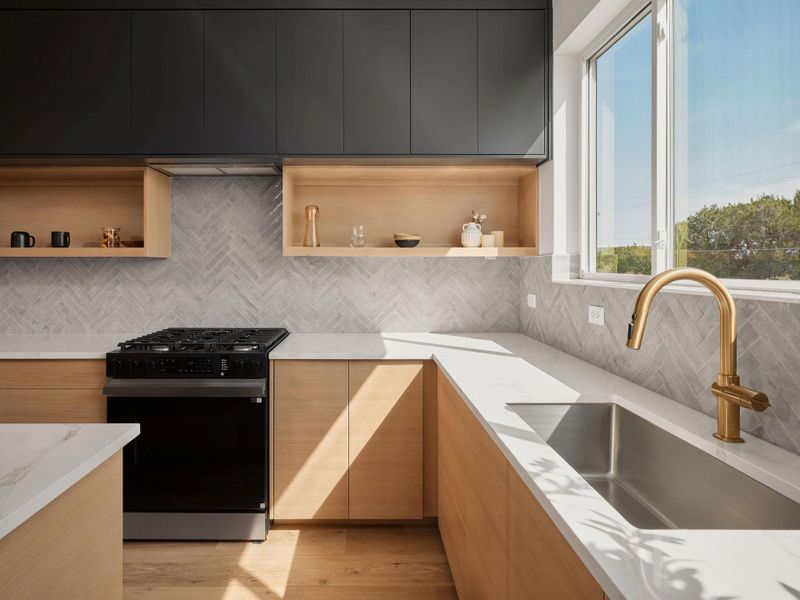 Kitchen with modern cabinets, open shelves, gas stove, and backsplash