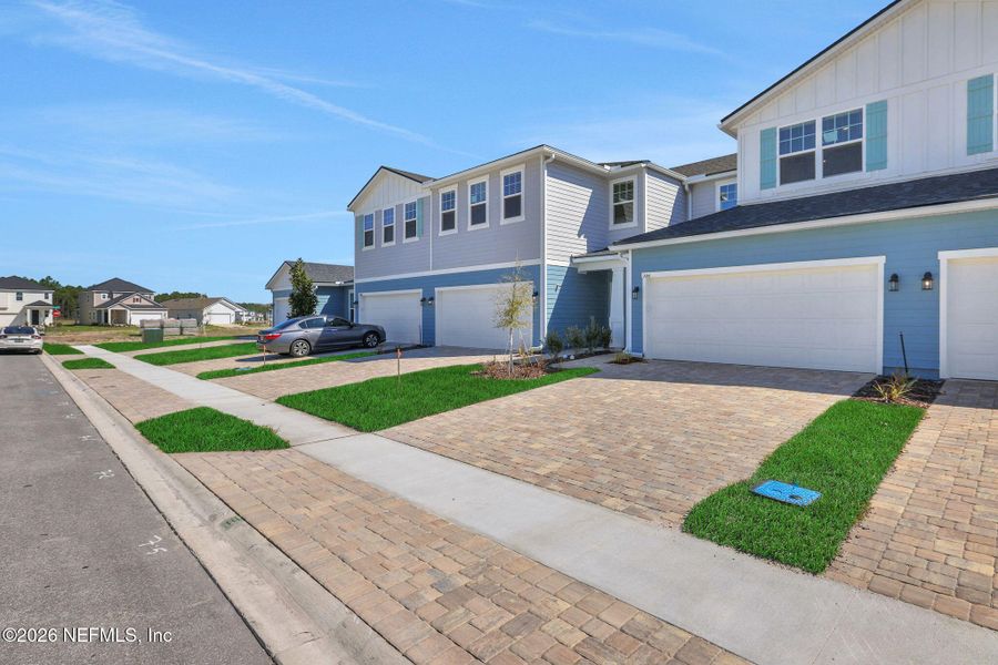 Front exterior of a new home in Brook Forest, St. Augustine, FL, highlighting curb appeal (Image 19).