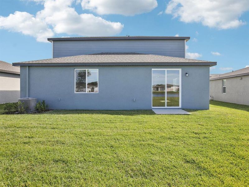 Exterior details and patio area of a home in The Grove at Stuart Crossing - Classic Series, Bartow (Image 23).