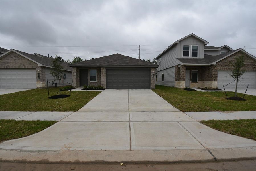 Front exterior of a new home in , Houston, TX, highlighting curb appeal (Image 1). Front exterior of a new home in , Houston, TX, highlighting curb appeal (Image 1).