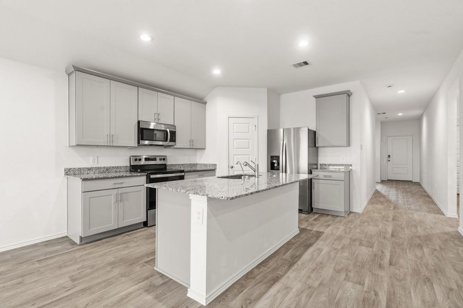 Nice kitchen open to the family and breakfast area
