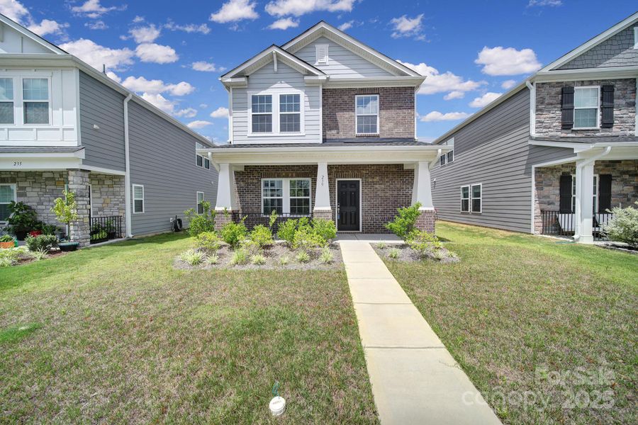 Front exterior of a new home in Preston Park, Pineville, NC, highlighting curb appeal (Image 18). Front exterior of a new home in Preston Park, Pineville, NC, highlighting curb appeal (Image 18).