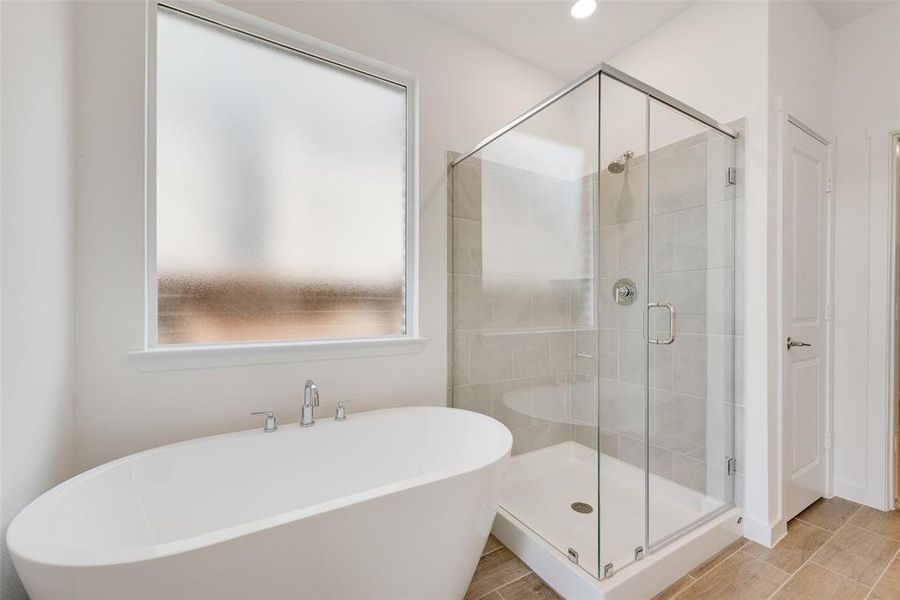 Bathroom featuring plus walk in shower