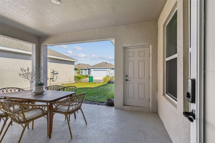Exterior details and patio area of a home in Persimmon Park - Cottage Series, Wesley Chapel (Image 3). Exterior details and patio area of a home in Persimmon Park - Cottage Series, Wesley Chapel (Image 3).