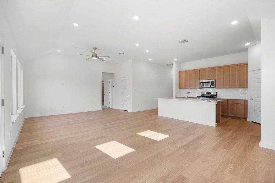 Living and Dining in the Sabine home plan by Trophy Signature Homes – REPRESENTATIVE PHOTO