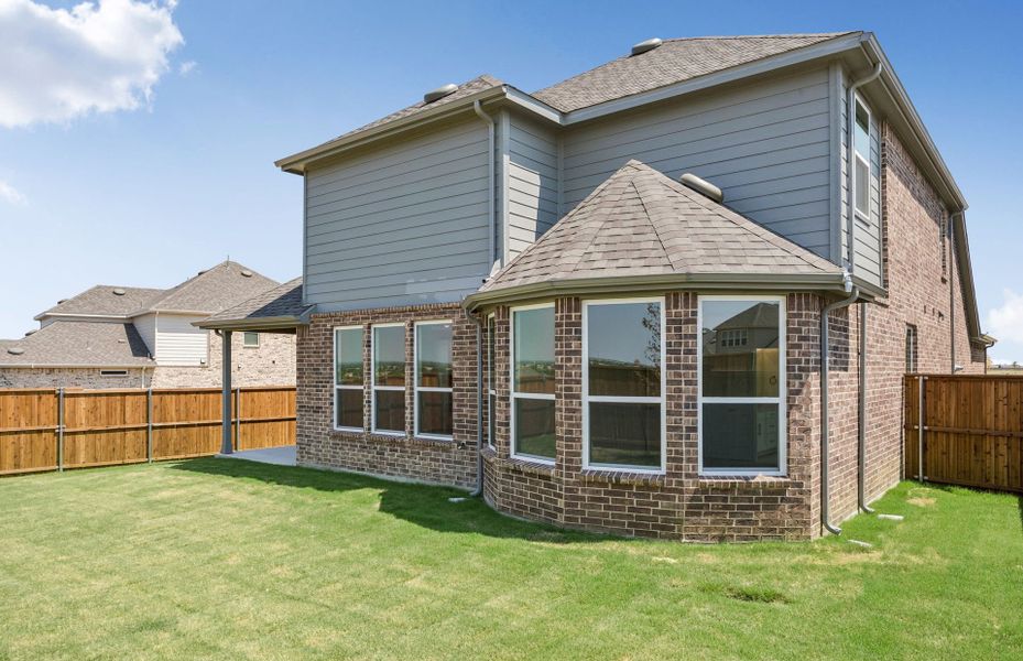 Exterior details and patio area of a home in Pinnacle at Legacy Hills, Celina (Image 3).