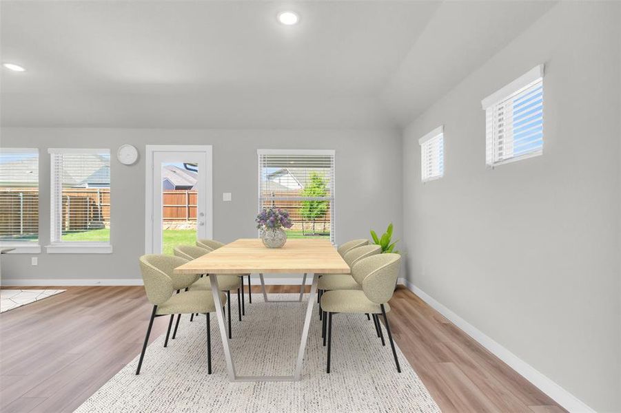 Dining room featuring baseboards, recessed lighting, and wood finished floors