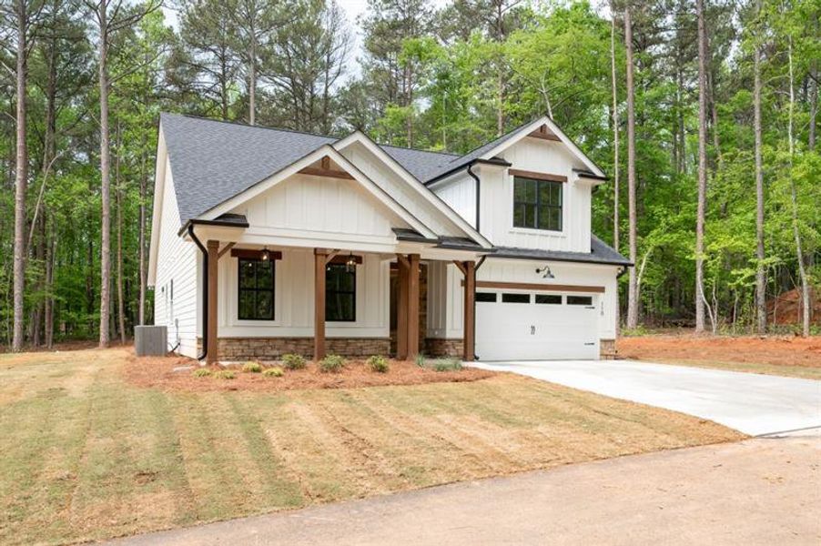 Front exterior of a new home in , Dallas, GA, highlighting curb appeal (Image 2).