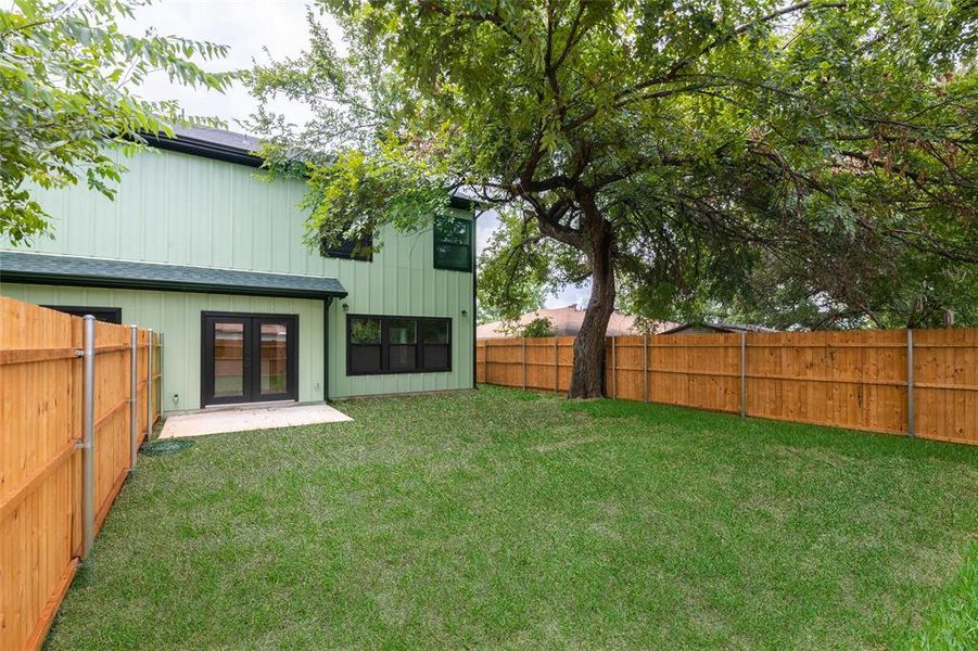 View of back yard featuring French doors