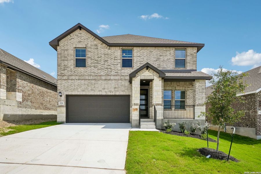 Front exterior of a new home in Arcadia Ridge - Premier Series, San Antonio, TX, highlighting curb appeal (Image 23).