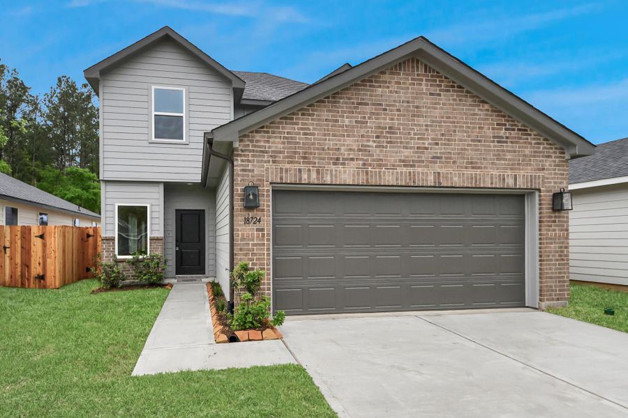 Front exterior of a new home in The Enclave at Spring Branch, Montgomery, TX, highlighting curb appeal (Image 28).