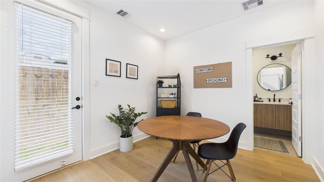 This first-floor secondary bedroom offers a private and convenient layout, featuring a spacious closet, a full ensuite bathroom, and direct access to the backyard ideal for guests or flexible everyday living.