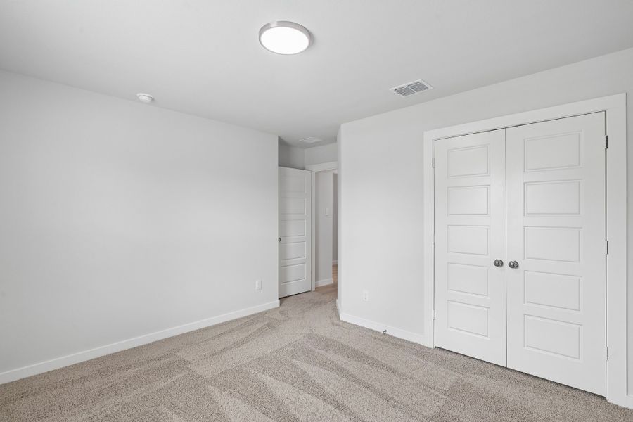 Bedroom in the Hayden home plan by Trophy Signature Homes