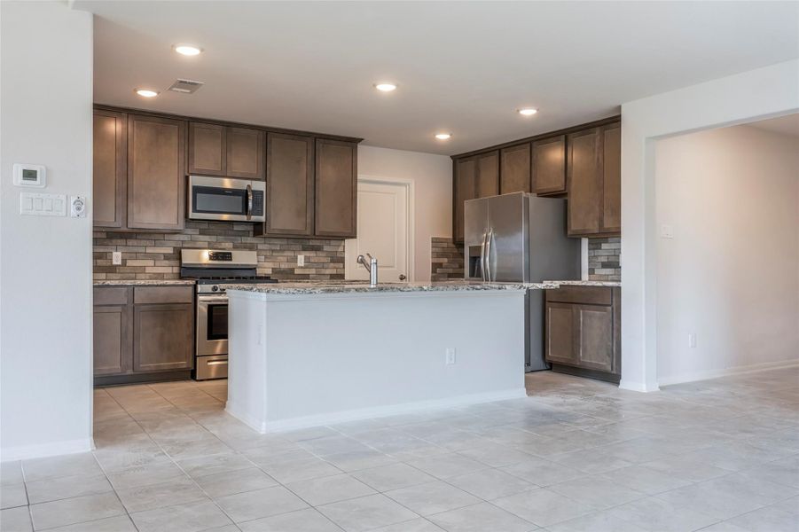 Furnished interior view inside a new home in Sunterra, Katy (Image 9).