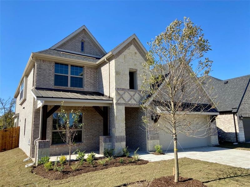 Beautiful new stone & brick home with metal roofs & cedar posts backs to Nature Area!