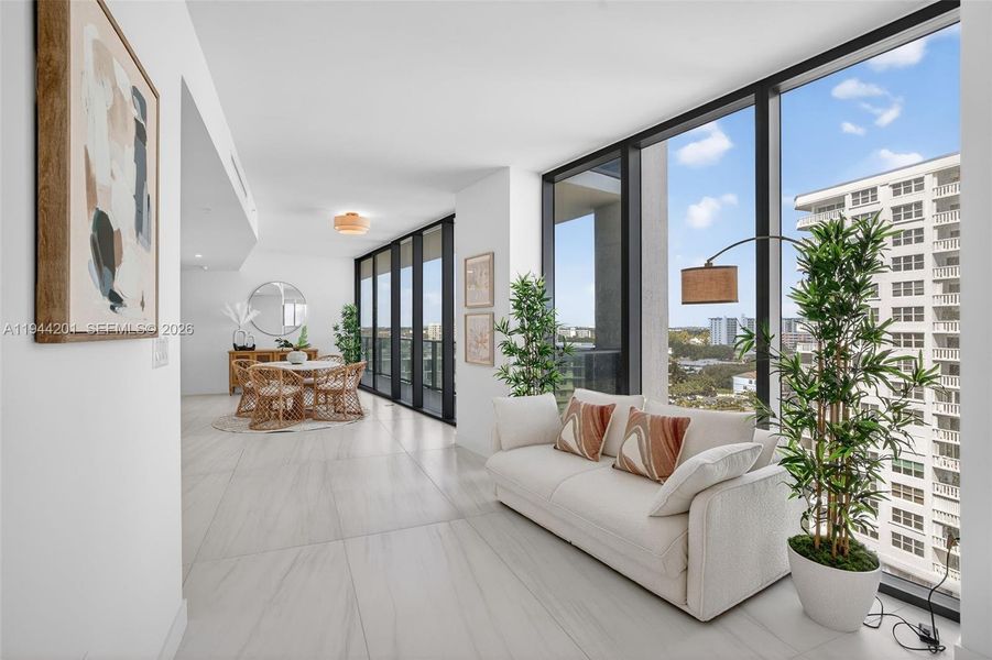 Light filled open living area with floor to ceiling glass and seamless indoor outdoor flow to expansive terrace.