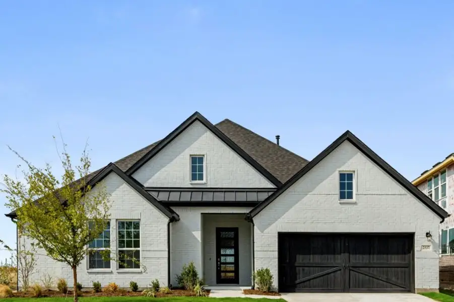 Representative exterior photo of a completed home built from the Mason by UnionMain Homes in Edgewater, Fate, TX (Image 5). Representative exterior photo of a completed home built from the Mason by UnionMain Homes in Edgewater, Fate, TX (Image 5).