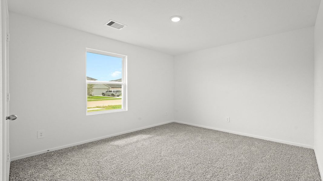 Spacious, unfurnished interior of a new home in Sunterra, Katy (Image 11).