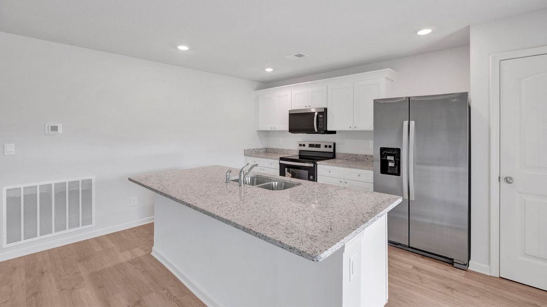 Furnished interior view inside a new home in Riggs Pointe, Millington (Image 5).