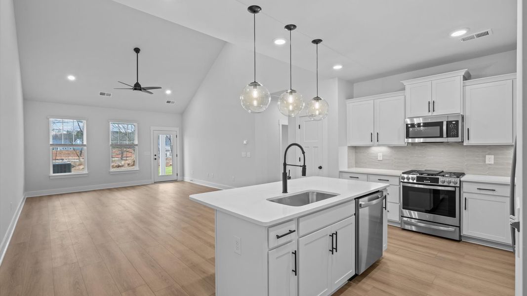 First-class finishes and a thoughtfully scaled island highlight this elegant kitchen space