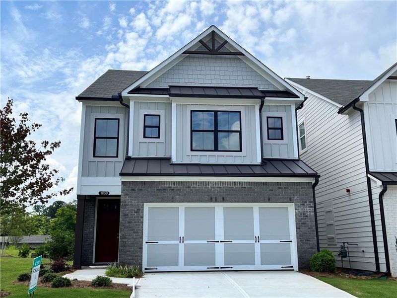 Front exterior of a new home in , Marietta, GA, highlighting curb appeal (Image 1).