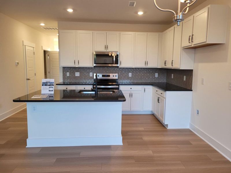 Furnished interior view inside a new home in 1158 Place Townhomes, Wilson (Image 5).