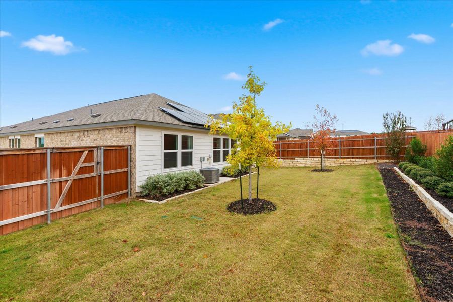 Exterior details and patio area of a home in Thunder Rock: Watermill Collection, Marble Falls (Image 24).