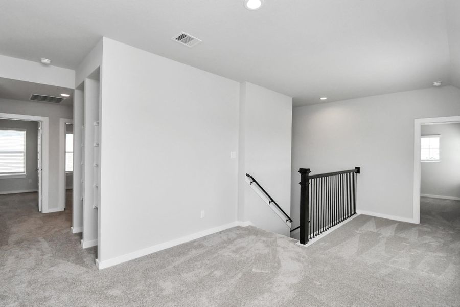 Come upstairs and enjoy a day of leisure in this fabulous game room! This is the perfect hangout spot or adult game room! Features plush carpet, high ceilings, custom paint and windows for plenty of natural light. Come upstairs and enjoy a day of leisure in this fabulous game room! This is the perfect hangout spot or adult game room! Features plush carpet, high ceilings, custom paint and windows for plenty of natural light.