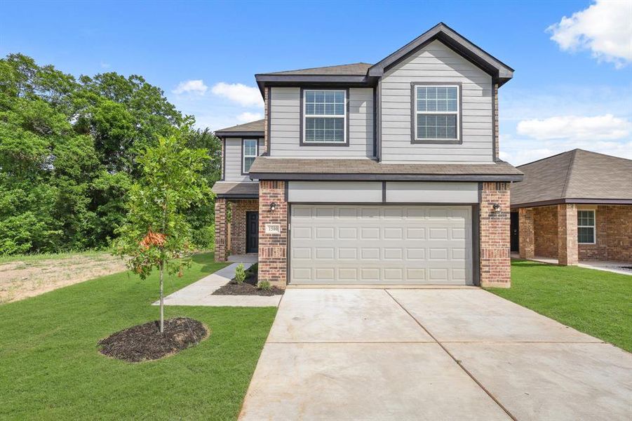 Front exterior of a new home in Christian Meadows, Ennis, TX, highlighting curb appeal (Image 2).