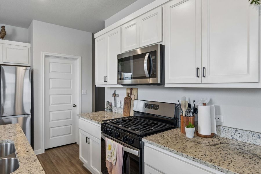 Furnished interior view inside a new home in Stallion Run, Buda (Image 7).