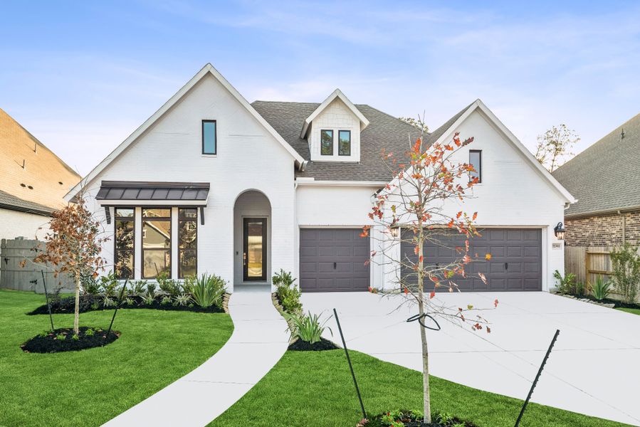 Front exterior of a new home in ARTAVIA - Parkview Collection, Conroe, TX, highlighting curb appeal (Image 1). Front exterior of a new home in ARTAVIA - Parkview Collection, Conroe, TX, highlighting curb appeal (Image 1).
