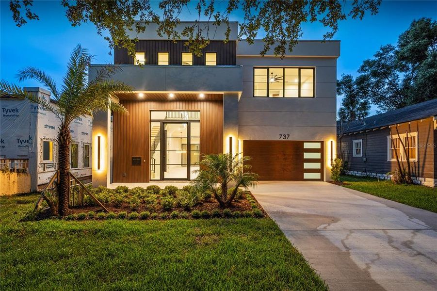 Front exterior of a new home in , Orlando, FL, highlighting curb appeal (Image 27).