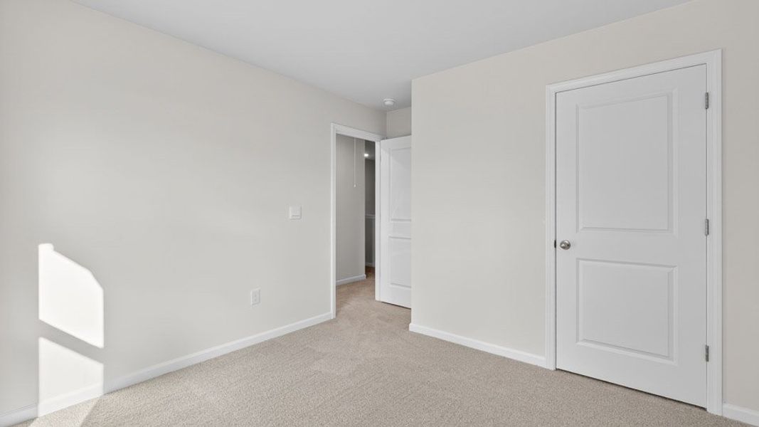 Spacious, unfurnished interior of a new home in The Townes at Honeycutt Oaks, Angier (Image 21).
