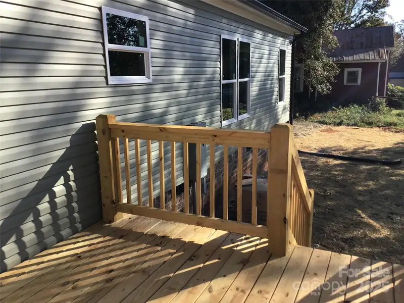 Front exterior of a new home in , Statesville, NC, highlighting curb appeal (Image 16).