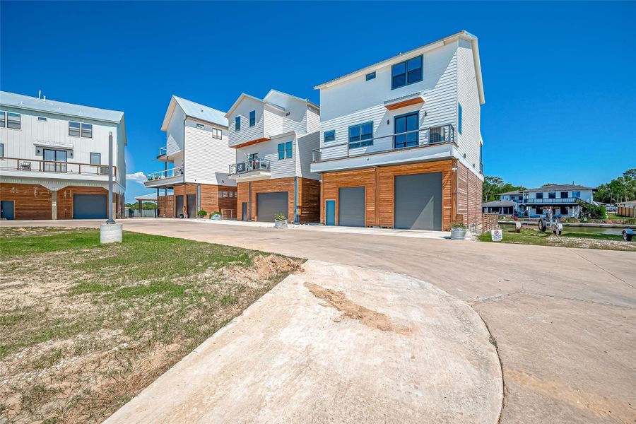 Front exterior of a new home in , Taylor Lake Village, TX, highlighting curb appeal (Image 5).