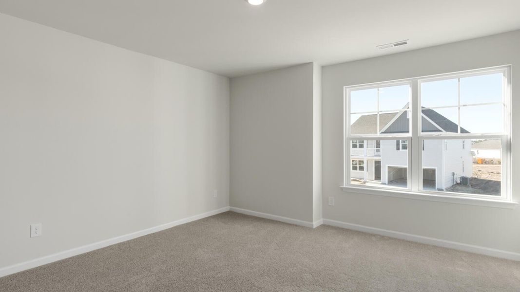 Spacious, unfurnished interior of a new home in Indigo Preserve, Leland (Image 41).