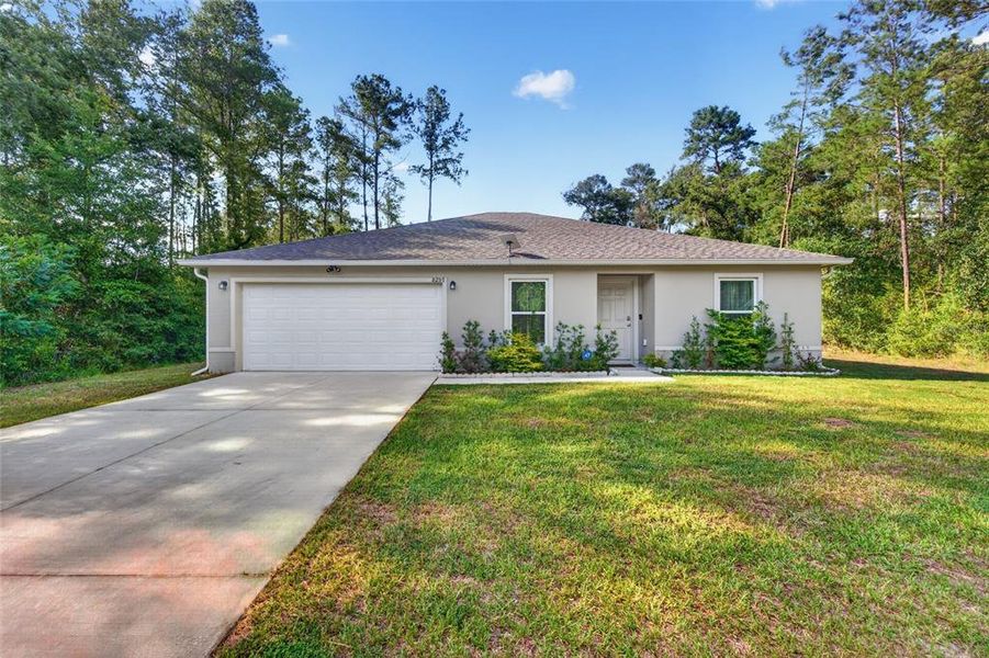 Front exterior of a new home in Ocala, Ocala, FL, highlighting curb appeal (Image 23). Front exterior of a new home in Ocala, Ocala, FL, highlighting curb appeal (Image 23).