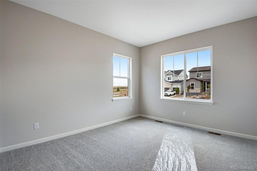 Spacious, unfurnished interior of a new home in Ensemble at The Aurora Highlands, Aurora (Image 20).