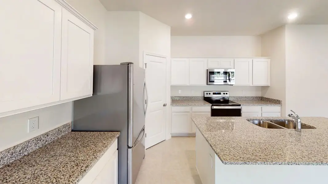 Representative furnished interior of a home built from the Magellan by Starlight Homes in Pelham Square, Deland (Image 6).