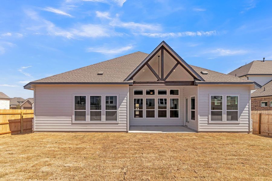 Back of property featuring a patio area, fence private yard, a yard, and roof with shingles Back of property featuring a patio area, fence private yard, a yard, and roof with shingles