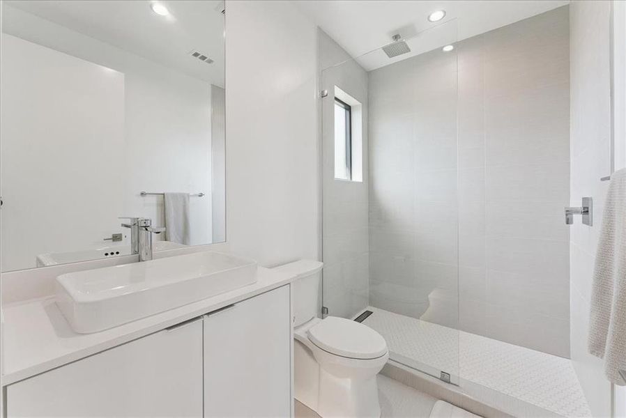 Full bath featuring walk in shower, double vanity, and recessed lighting