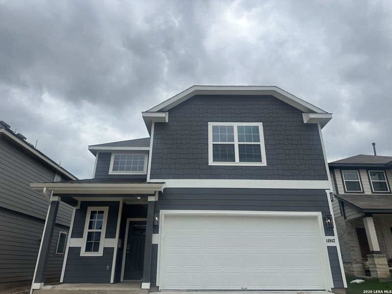 Front exterior of a new home in Timber Creek, San Antonio, TX, highlighting curb appeal (Image 2). Front exterior of a new home in Timber Creek, San Antonio, TX, highlighting curb appeal (Image 2).